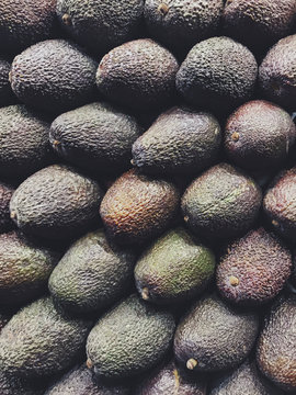 Pile of organic avocados at farmer's market