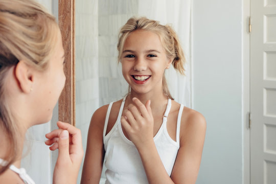 Lovely girl posing in mirror