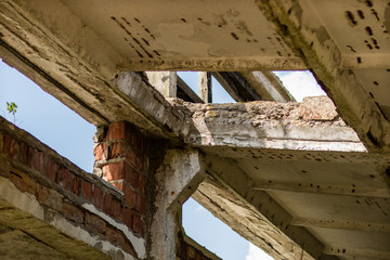 Obraz premium Destroyed state farm in Central Europe. Ruins of farm buildings. Season of the summer.