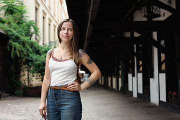 Portrait of young woman on city street