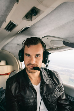Portrait of Handsome Caucasian Man With Headset Flying in Privat