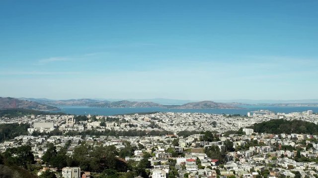San Francisco Bay from Twin Peaks, looking north toward Alcatraz.  Early October, mid-day.  Air show jet enters the frame from the right then climbs out of the frame trailing smoke.