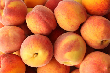 Fototapeta na wymiar Fresh sweet ripe peaches as background