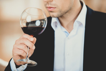 Close up of Young Man Drinking Glass of Red Wine