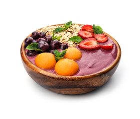 Bowl with tasty acai smoothie on white background