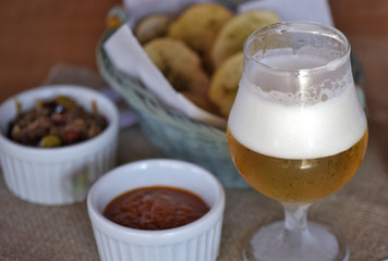 Bar food: glass of beer with appetizers