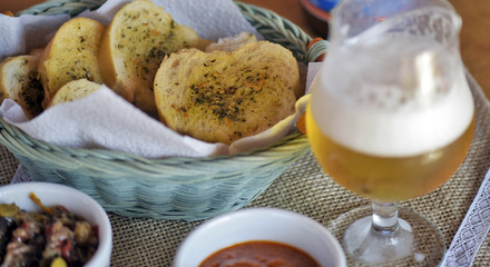 Bar food: glass of beer with appetizers
