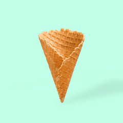 Waffle cornet on a light green background