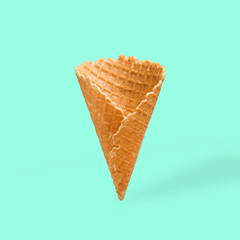 Waffle cornet on light blue background
