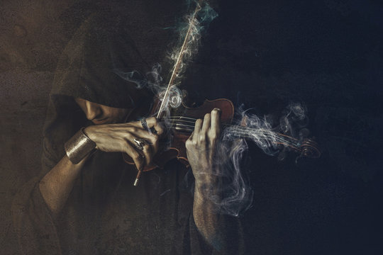 Dark Phantom Violin Player, Man Performing A Concert Shrouded In Smoke And Fog