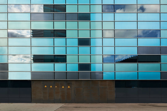 Squared geometric facade of modern building.