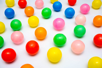 colorful plastic balls on a white background