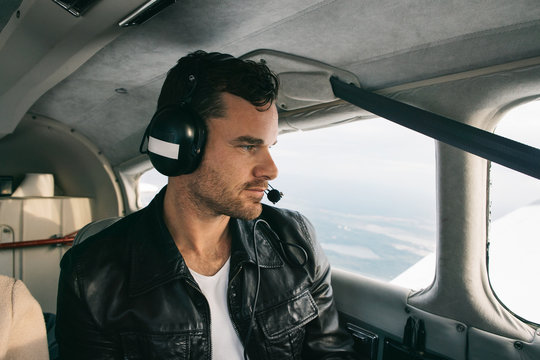Profile of Handsome Caucasian Man With Headset Flying Private an