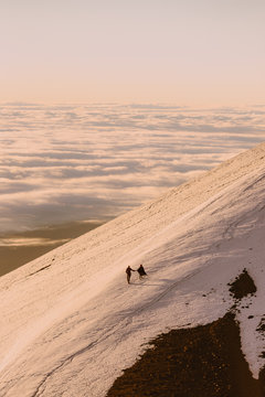 A couple walking on the top of the mountain
