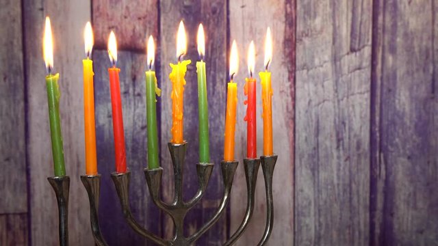 abstract retro of jewish holiday Hanukkah with menorah traditional defocused lights with glitter overlay Selective soft focus