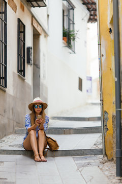 Woman doing tourism with map at Granada, Spain.