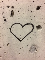 simple heart drawn on porous wall 