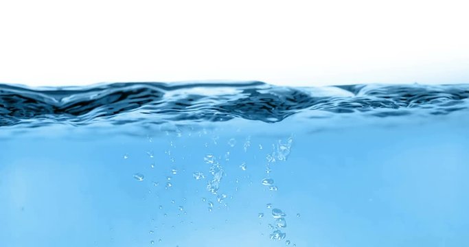 blue wave water with bubbles in tank on white background, slow motion movement, concept of clean and purity