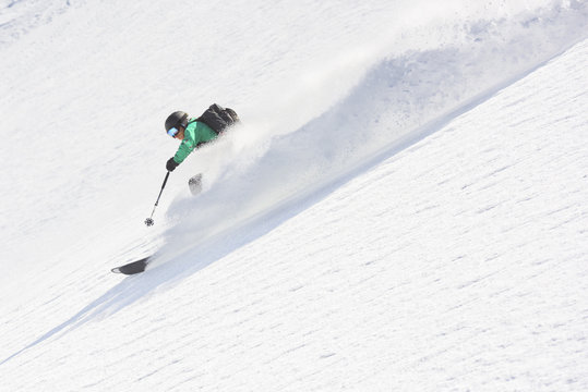 Man Skiing Downhill Steep Slope With High Speed