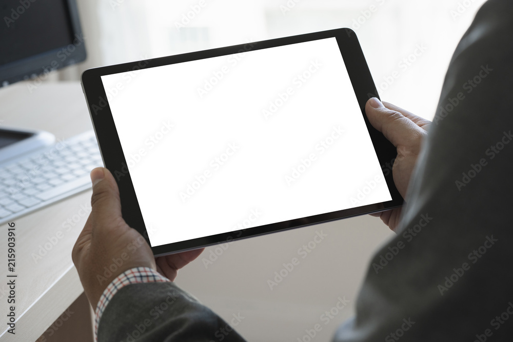 Poster digital tablet computer close up man using tablet hands man multitasking with isolated screen