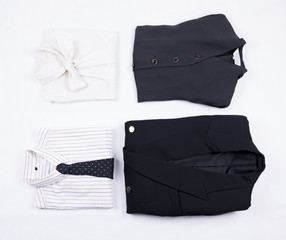 Flat lay of business or office formal suits. Male and female clothes.