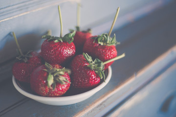 Bowl of Strawberries on Wooden Table