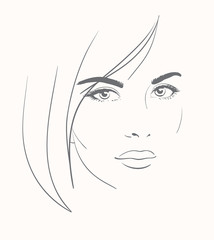 Young woman face with long blond hair