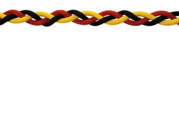 Germany flag wavy made from three colors ropes. Isolated on white
