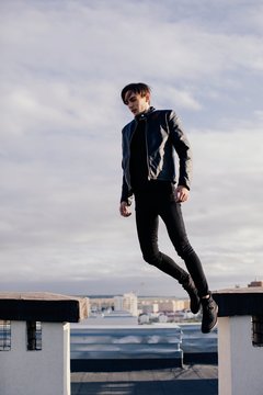 Young stylish man pretending to fly