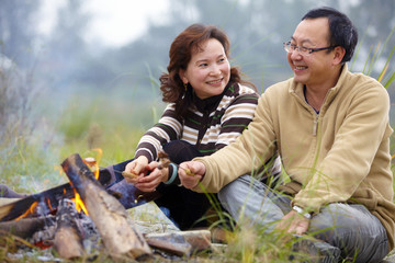 happy asian couple picnic outdoor