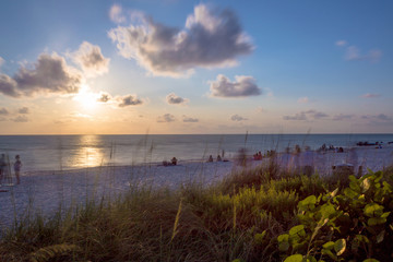 Fototapeta na wymiar Panoramic view of a Beach in Naples at early morning with the sun coming up in a summer sunny day, Florida, USA.