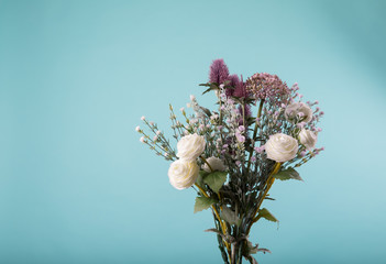 fresh bouquet of fresh flowers on light background.