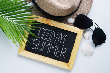 Goodbye Summer Text. Sunglasses, Fedora Hat, Palm Leaf, Sea Shells and Blackboard Room for Text....