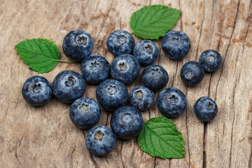 Blueberries on old wooden table.