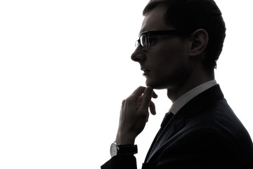 Silhouette of a thinking businessman.
