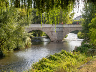 Fototapeta na wymiar Arlanzón river and the Santa Maria bridge - Burgos, Castile and Leon, Spain