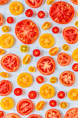 Slices of Tomatoes Over Blue Background