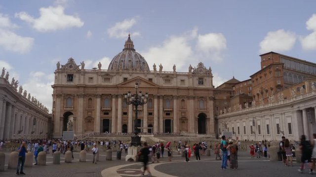 Vatican, Rome. St. Peter's Square full of tourists. View to St. Peter's Basilica. Vatican is a holy place, the heart of Christian culture and religion. Timelapse.