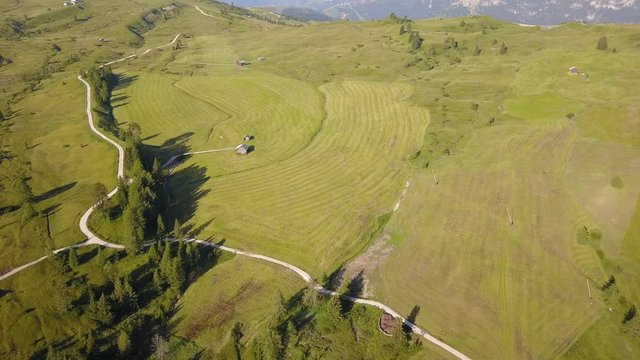 Aerial drone landscape of the meadows at high altitudes, forming soft hills. Dolomites, Alta Badia, Sud Tirol, Italy
