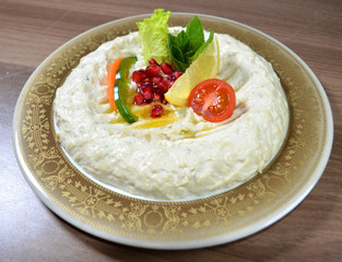 homos appetizer ( arab appetizer contains blended chickpeas mixed with spiced ,oil and tehinia )