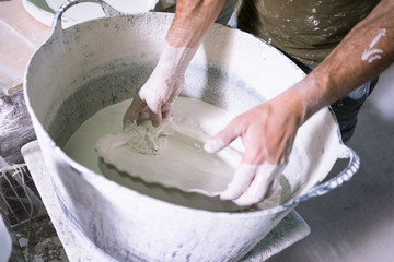 Ceramic dishes in working process. Creating ceramic pieces. Tradicional ceramic factory in spain
