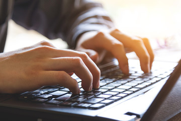 hand using mobile laptop computer