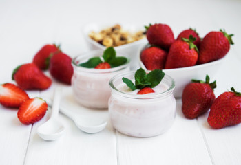 healthy breakfast, yogurt, fresh strawberries and granola