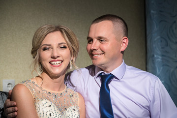 Beautiful bride and groom in the room before wedding ceremony