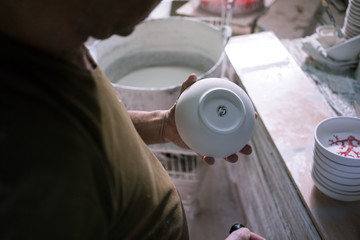 Ceramic dishes in working process. Creating ceramic pieces. Tradicional ceramic factory in spain