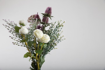 beautiful bouquet of fresh flowers on light background.