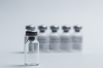 Medical vials for medicines on white background close-up