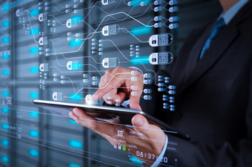 businessman  using tablet computer and server room background