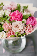 beautiful summer bouquet. flower arrangement with peonies. Color light pink. The concept of a flower shop.
