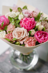 beautiful summer bouquet. flower arrangement with peonies. Color light pink. The concept of a flower shop.